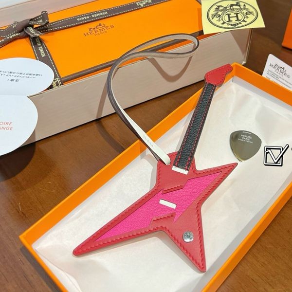 Extremely rare! Hermes Rock Charm with stainless steel guitar pick ers30828