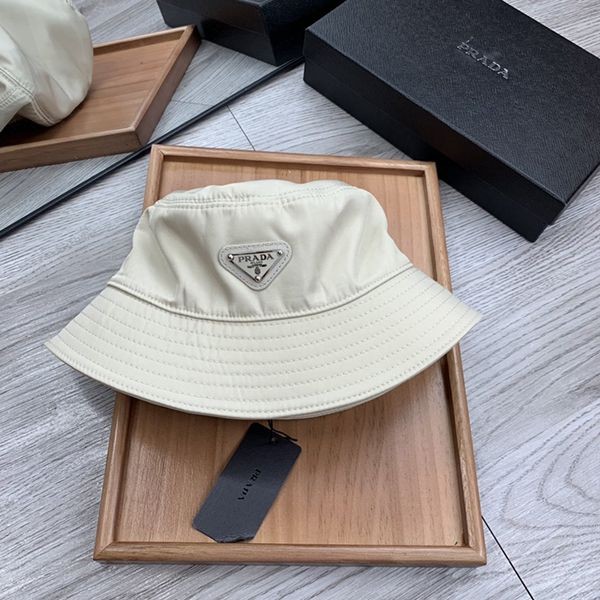 Replica Prada nylon bucket hat with logo plate, yellow pum45013