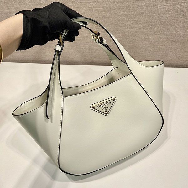 Easy to use Prada medium leather tote bag replica puv64586
